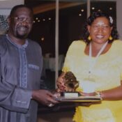Receiving-a-gift-from-Africa-Rice-chair-of-Governing-Council-Dr-Papa-Seck-e1538133020831