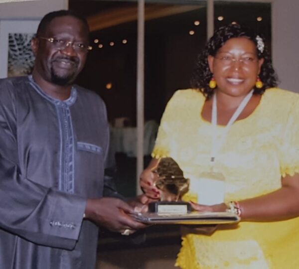 Receiving-a-gift-from-Africa-Rice-chair-of-Governing-Council-Dr-Papa-Seck-e1538133020831